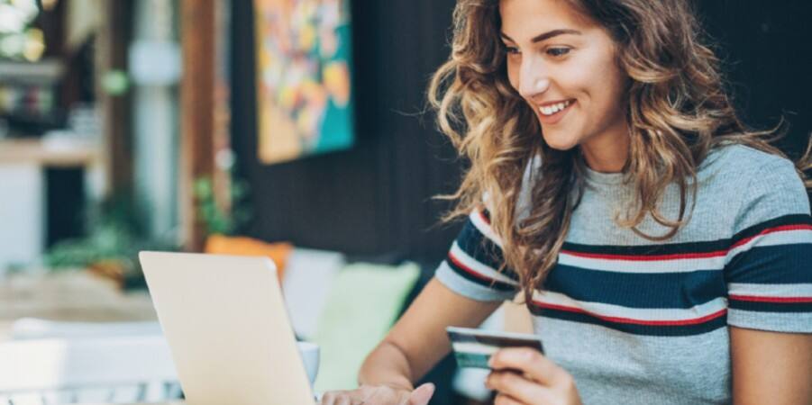 girl booking with a card