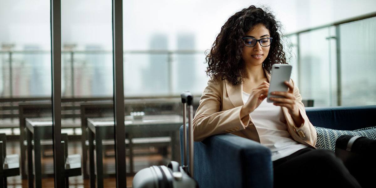 Woman with bag talking on phone