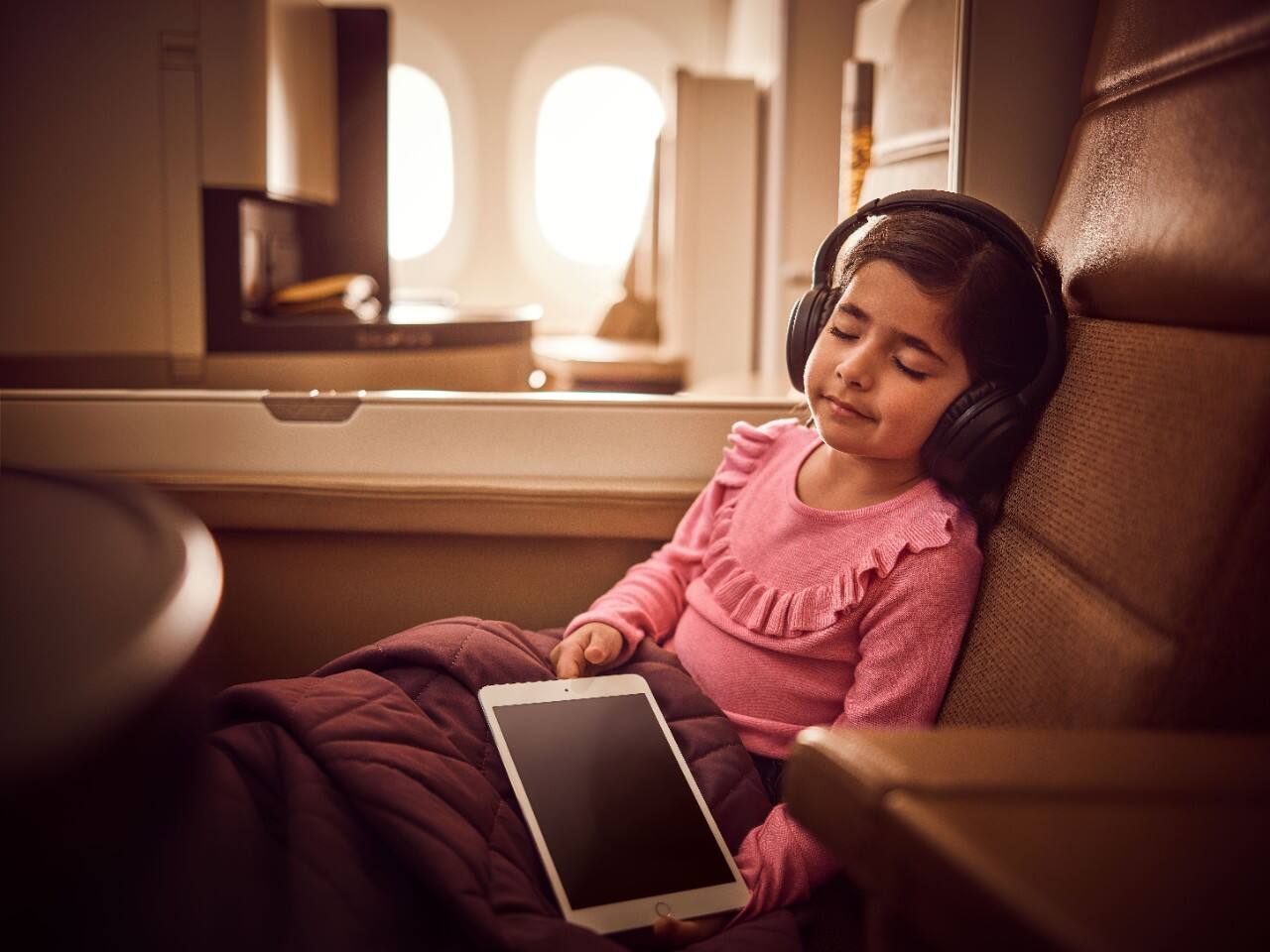 child sleeping in flight