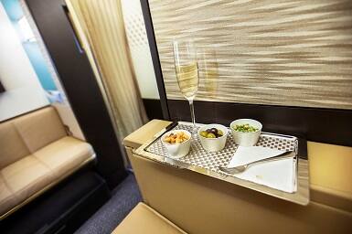 wine with snacks served on etihad first class 
