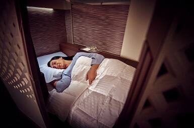 guest sleeping in first class cabin